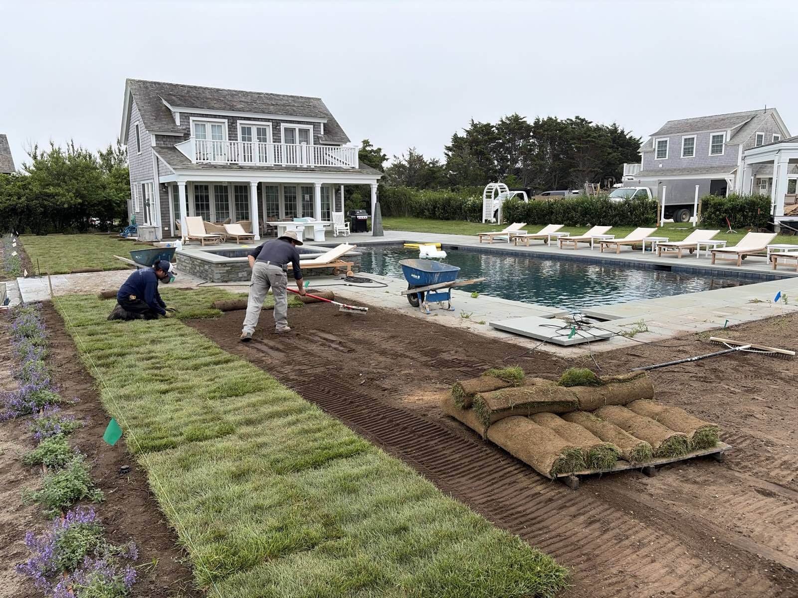 Ryan Conway Landscaping crew laying fresh sod and lawn at a Nantucket poolside property